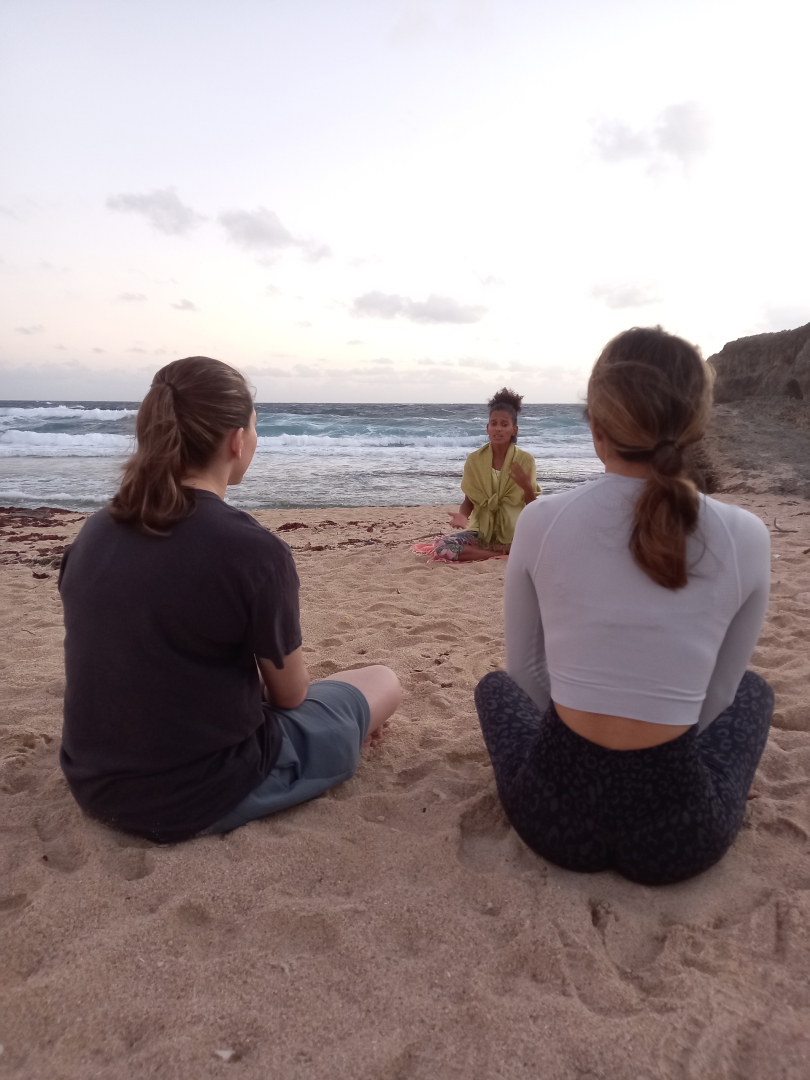couple beach meditation aruba