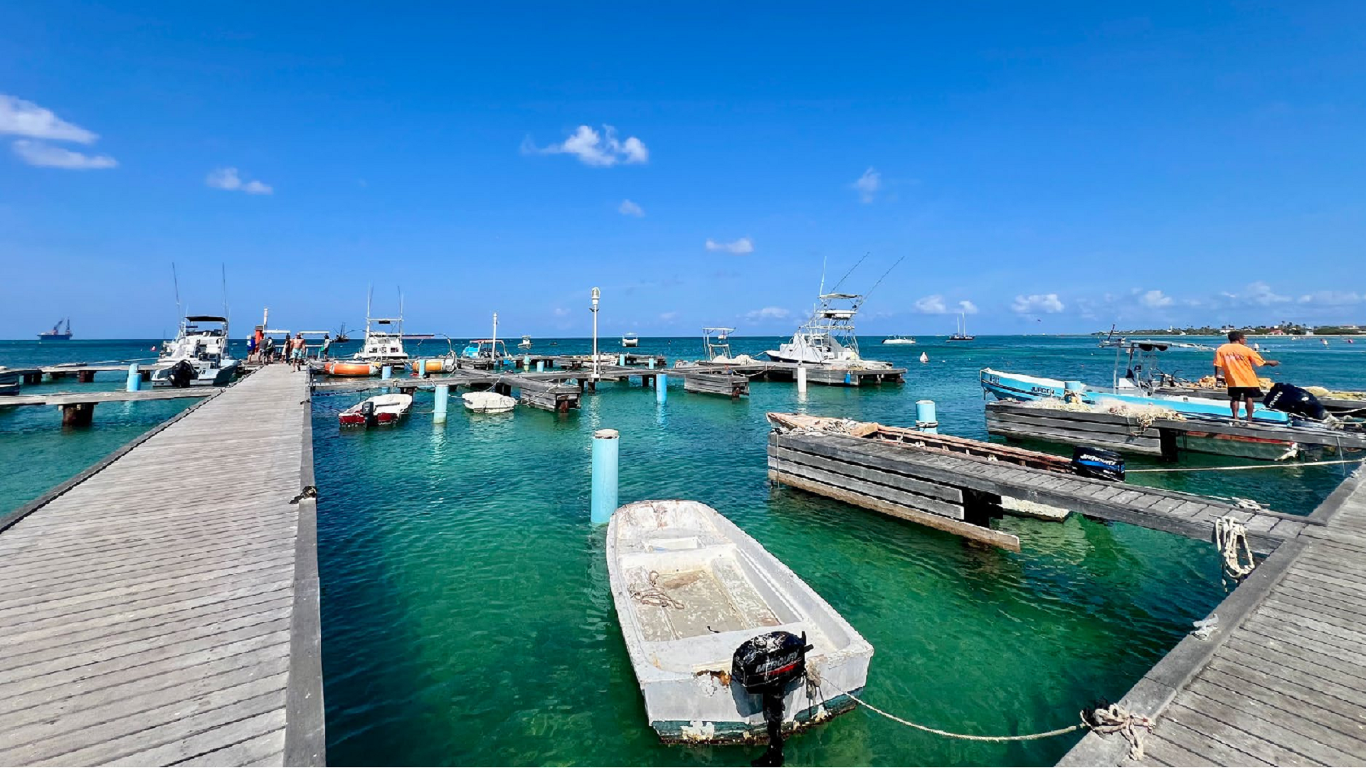 Marina and boats along Aruba’s coast showcasing community reliance on healthy oceans and resilient coastal infrastructure